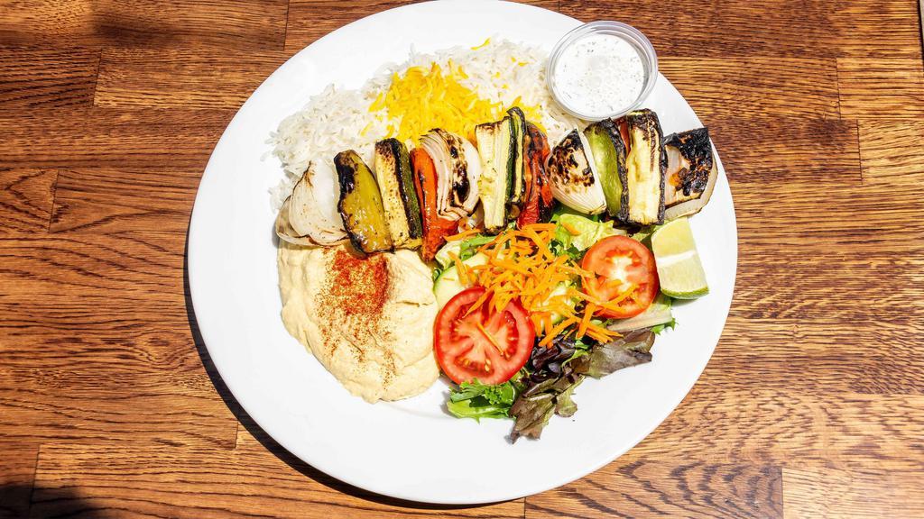 Veggie Kabob Plate · Vegetarian, gluten free. A combination of grilled bell pepper, zucchini, onion, and tomato. Served with white or brown rice, salad, and hummus.
