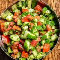Shirazi Salad · Vegetarian, gluten free. Chopped Persian cucumber, tomato and parsley with a lemon mint dres...