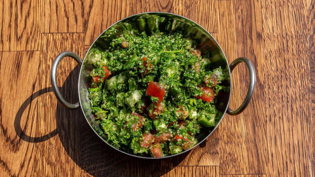 Tabouli Salad · Vegetarian. Chopped Persian cucumber, tomato, parsley, and bulgur with lemon dressing.