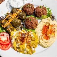 Veggie Combo · Vegetarian, gluten free. Mix of hummus, eggplant dip, falafel, and dolmeh. Served with pita ...