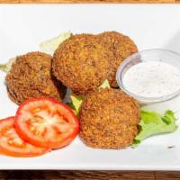 Falafel · Vegetarian, gluten free. Four pieces. Vegetarian patties from garbanzo and spices. Served wi...