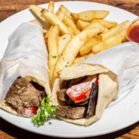 Lamb Gyro Sandwich · Ground beef and lamb, lettuce, tomato, and pickles. Served in pita.