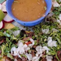 Asada Taco · Grilled beef onions, cilantro and salsa.