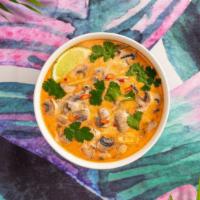 Vegan Tom Kha · Flavorful coconut soup with mushrooms and your choice of tofu or vegetables.
