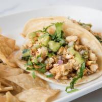 Chicken Tacos · (4 tacos) grilled chicken breasts, corn tortillas, cilantro, onions, avocado crema served wi...