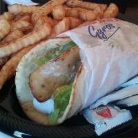 Gyro · Cuts of seasoned meat with tomatoes, onions, Romaine lettuce Wrapped in pita bread & topped ...