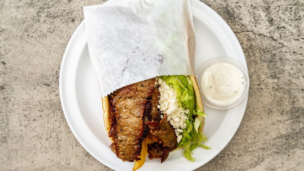 Supreme Gyros · Slices of seasoned meat in pita with lettuce, tomatoes, onions, fried potatoes, feta cheese and tzatziki sauce.
