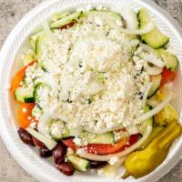 Greek Salad · Lettuce, tomatoes, cucumber, onions, pepperoncinis, olives and feta cheese with a Greek vina...