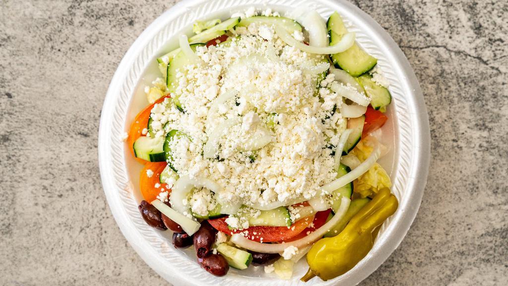 Greek Salad · Lettuce, tomatoes, cucumber, onions, pepperoncinis, olives and feta cheese with a Greek vinaigrette dressing.