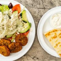Falafel · Six pieces of falafel in pita with lettuce, tomatoes, cucumber and your choice of tahini or ...