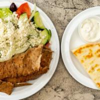 Gyros Dinner · Beef, lamb or chicken. Slices of seasoned meat with rice pilaf, a spanakopita, dolmas, pita ...