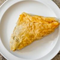 Spanakopita · Spinach and feta cheese wrapped in phyllo.