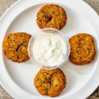Side Falafel · Pieces of falafel served with tahini or tzatziki sauce.