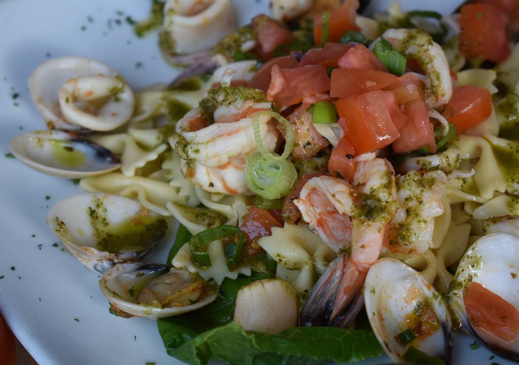 Seafood Pasta Salad · Bow tie pasta, shrimp, scallops, calamari, clams and mussels.