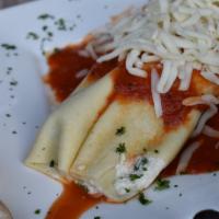 Manicotti Di Ricotta · Pasta tubes stuffed ricotta cheese and spinach in marinara sauce.