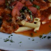Penne Puttanesca · Pasta tossed in marinara sauce with garlic, capers, mushrooms and olives.