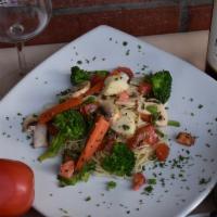 Capellini Primavera With Shrimp · Angel hair pasta, fresh mix veggie and garlic shrimp, marinara sauce.