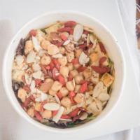 Vegan Bowl · Tofu, garbanzo beans, greens mix, raspberry vinaigrette, quinoa, almonds, goji berries.