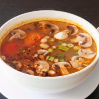 Tom Yum Soup · Spicy and sour soup with choice of meats, mushroom, tomato, lemongrass, galangal and kaffir ...