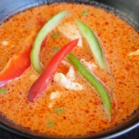 Panang Curry · Panang curry in coconut milk with choice of meat, pea & carrot and bell pepper.