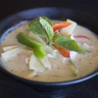 Green Curry · Green curry in coconut milk with choice of meat, bamboo shoot, bell pepper and basil leaves.