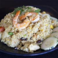 Pineapple Fried Rice · Fried rice with shrimp & chicken, egg, pineapple, tomatoes, raisin, cashew nuts in curry pow...