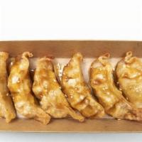 Fried Dumplings · A mix with Chicken, Pork and Vegetables