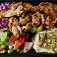 Chicken Kabob Plate · All plates are served with hummus, rice, salad, pita bread, and pickles.