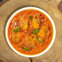 Kadai O'Cluck · Tender chicken breasts stir fried with bell peppers, onions, & tomatoes in a light gravy.