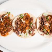 Street Taco · Small corn tortilla with meat, cilantro, onion, and salsa. One taco. Add meat for an additio...
