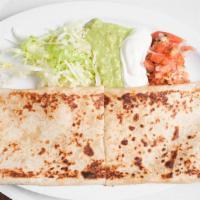 Super Quesadilla · Flour tortilla with meat and cheese inside. A side of lettucce, sour cream, guacamole, and p...