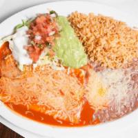Cheese Enchilada Plate · 2 Red Cheese Enchiladas with melted cheese. Served with rice, refried beans, lettuce, sour c...