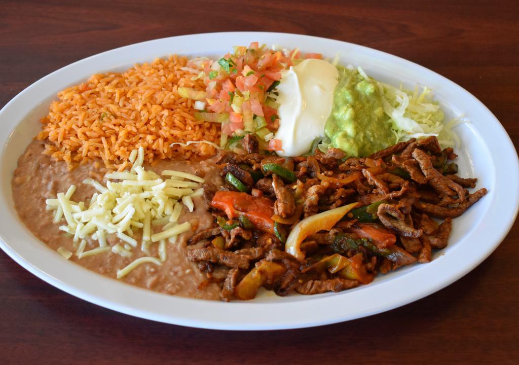 Steak Ranchero · Small beef strips with peppers, tomatoes, and onions.