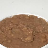 Beans 8 Oz · Side of refried beans.
