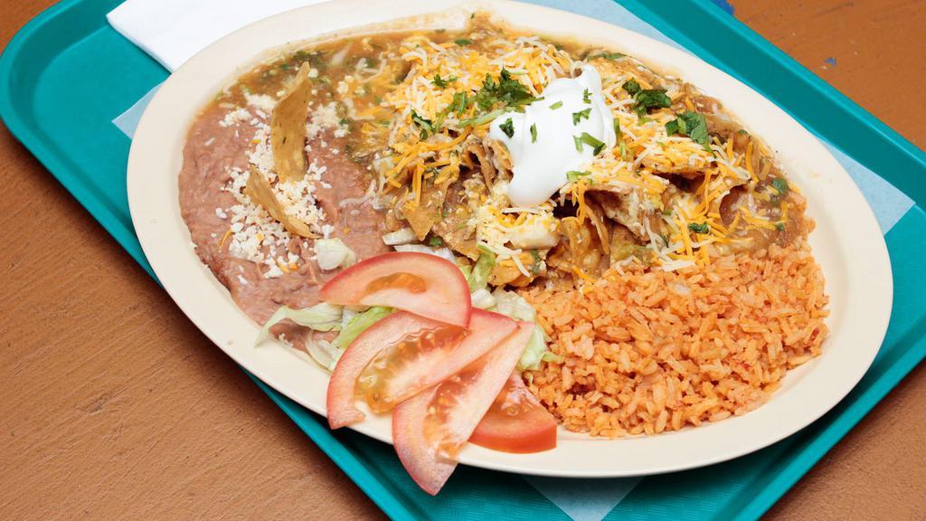 Chilaquiles Plate · Served with rice, beans, cilantro, onion, sour cream and cheese