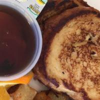 French Toast · Homemade french toast served with syrup.