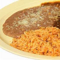Huevos Rancheros  · Vegetarian. Over easy eggs topped with mild or hot sauce served with rice, beans and handmad...