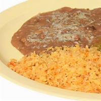 Huevos Chile Verde  · Spicy. Eggs over a lightly fried tortilla topped with pork mixed in green sauce served with ...