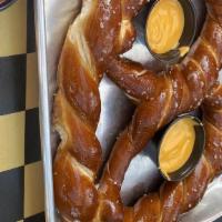 Bavarian Pretzel Small · Bavarian Style hand twisted pretzel topped with salt and served with side of house made warm...