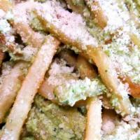 Jalapeno Truffle Fries · Our Crispy fries tossed in our house made jalapeno pesto, parmesan cheese and truffle oil