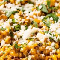 Street Corn · Roasted corn off the cob, tossed in a creamy sauce, topped with cilantro, queso fresco, and ...