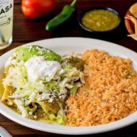 Shrimp Enchilada Dinner · sauteed shrimp, cheese, salsa verde, sour cream, lettuce, avocado, and queso fresco