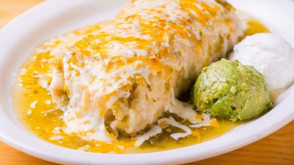 Grande Burrito · choice of meat, refried beans, rice, lettuce, guacamole, sour cream, cheese, your choice of sauce