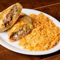 California Burrito · Carne Asada, French fries, cheese, pico de gallo, sour cream, and avocado sauce, served with...