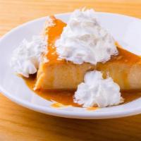 Flan · Traditional custard dessert with whipped cream and caramel.