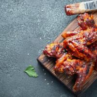 Bbq Hot Wings · 8 juicy chicken wings flavored with hot BBQ sauce.