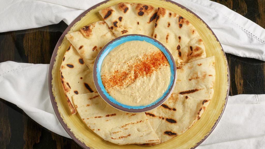 *Hummus · Vegetarian. Creamy blend of hummus. Accompanied by a pita bread.