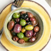 Mixed Olives · Green and black olives infused with red peppers and a hint of chili. Vegetarian.