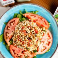 Couscous Salad · Tomato-basil couscous, cucumbers, onions and basil, topped with balsamic vinaigrette mix.