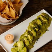 Shrimp Agua Chile · Lime n' mild herb cured, cucumber, avocado, onion, aioli, served w/ chips
